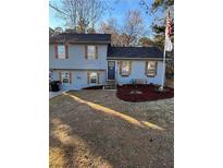 Charming two-story home featuring blue siding, complemented by decorative shutters and a well-maintained front yard at 184 Cedarcrest Dr, Acworth, GA 30101