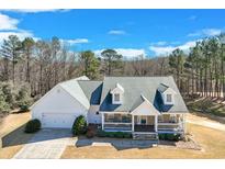 Charming single-Gathering home features a covered front porch, dormer windows and an attached two-car garage at , Auburn, GA 30011