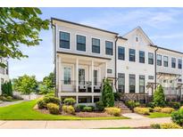 Charming townhome with a landscaped front yard and inviting porch in a desirable community at 1716 Morningtide Ne Ln, Atlanta, GA 30324