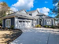 Stunning home featuring a side-entry garage, landscaped yard, and arched entryway at 4350 Highborne Ne Dr, Marietta, GA 30066