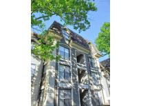 Beautiful condominium building with balcony, and multiple windows and lovely architecture and surrounded by trees at 2657 Lenox Ne Rd # 29-1, Atlanta, GA 30324