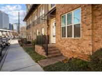 Charming brick townhouse with well-maintained landscaping and a welcoming entrance at , Atlanta, GA 30363