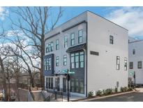 Modern three-story townhome with large windows and a clean, contemporary design at 728 Se Eloise Se Way, Atlanta, GA 30312