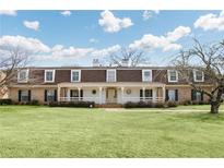 Expansive two-story home with a long front porch, manicured lawn, and mature trees at 3825 Lavista Rd # Q3, Tucker, GA 30084