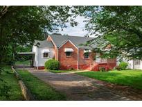 Charming brick home with a well-maintained lawn and a long driveway at 2656 Northview Ave, Decatur, GA 30032