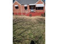 Charming brick home features a yard and covered windows, offering classic curb appeal at 2656 Northview Ave, Decatur, GA 30032