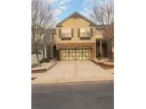 Charming two-story home with a two-car garage and well-maintained landscaping at 2530 Gold Creek Ln, Cumming, GA 30041