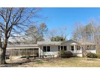 Charming single story home featuring a covered carport and a cozy front porch at 74 Sandy Path, Rockmart, GA 30153
