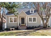 Charming home featuring a craftsman-style design, neutral siding, manicured lawn, and an inviting front entrance at 351 Delmont Ne Dr, Atlanta, GA 30305