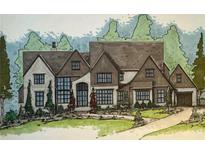 Charming elevation of the house features a brick and wood facade, beautiful landscaping, and large windows at 4635 Whitestone Way, Suwanee, GA 30024
