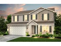 Stunning two-story home featuring a brick and siding exterior, well-manicured lawn, and an attached two-car garage at 205 Delilah St, Mcdonough, GA 30252