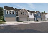 Charming townhome community featuring craftsman-style architecture and attached garages at 1115 Lockhart Way, Douglasville, GA 30135