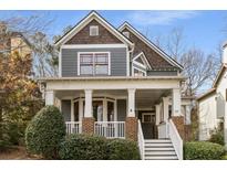 Charming two-story home with a covered front porch and manicured landscaping at 1337 Benteen Park Se Dr, Atlanta, GA 30315