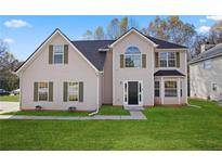 Charming two-story home with a well-manicured lawn and welcoming entrance at 3649 Salem Glen Rd, Lithonia, GA 30038