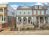 Charming two-story home with a welcoming brick porch and beautifully landscaped front yard at 4308 Southside Dr, Acworth, GA 30101