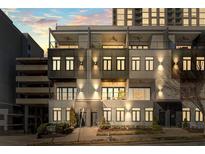 Modern townhome exterior with multi-level balconies, large windows, and contemporary architectural details at 223 16Th Nw St # 2, Atlanta, GA 30363