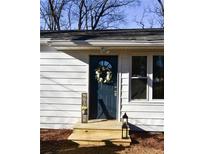 Charming front entry with a blue door, wreath, and a warm welcome sign at 3601 Orchard Cir, Decatur, GA 30032