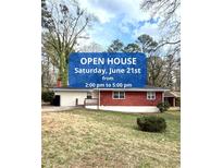 Charming brick and siding home with well-maintained front yard; great curb appeal at 2182 Rosewood Rd, Decatur, GA 30032