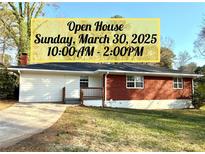 Charming single-story home with red brick and white siding is promoting an open house on Sunday, March 30, 2025 at 2182 Rosewood Rd, Decatur, GA 30032