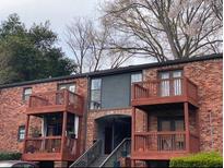 Charming brick building with multiple levels and private balconies, offering a cozy and inviting living space at 323 Ne 8Th Ne St, Atlanta, GA 30309