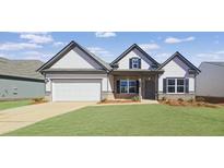 Charming single-story home featuring a well-manicured lawn, attached two-car garage, and gabled roof design at 524 Lanier Way, Temple, GA 30179