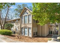 Charming, two-story condo with lots of natural light from large windows and mature landscaping at 1506 Country Park Se Dr, Smyrna, GA 30080