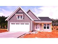Charming single-story home with a two-car garage and a covered porch, blending modern design with a cozy feel at 33 Cambridge Ln, Dallas, GA 30157