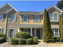 Charming townhome with stone accents, neutral siding, and well-maintained landscaping at 585 Mcwilliams Se Rd # 2602, Atlanta, GA 30315