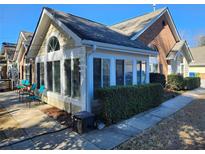 Inviting sun room with large windows and outdoor patio seating area for relaxing and entertaining at 1203 Cascade Park Sw Dr, Atlanta, GA 30331