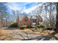 Charming two-story brick home with a well-manicured front yard and a driveway at 5960 Camelia Dr, Douglasville, GA 30135