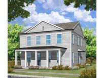 Charming two-story home with a welcoming front porch and beautiful landscaping at 51 Hydrangea Unit 74 Way, Auburn, GA 30011
