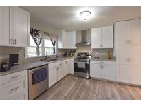 Bright kitchen featuring white cabinets, stainless steel appliances, and granite countertops at 4289 Post Rd, Winston, GA 30187