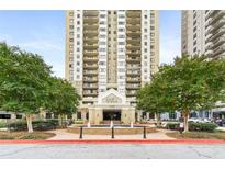 The Park Towers high-rise features a stylish entrance with fountain and lush landscaping, enhancing its curb appeal at 795 Hammond Dr # 801, Atlanta, GA 30328