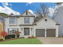 Stunning two-story home featuring a charming facade, well-manicured lawn, and a two-car garage at 3669 Clearbrooke Way, Duluth, GA 30097
