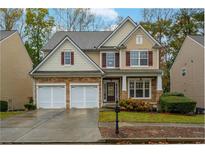Charming two-story home with stone accents, attached two-car garage, and manicured landscaping at 2501 Fieldview Way, Buford, GA 30519