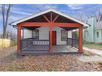 Inviting covered front porch with a charming entrance and black wood railing at 391 S Bend Se Ave, Atlanta, GA 30315