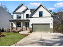 Stunning two-story home with a well-manicured lawn and a two-car garage at 3255 Hilltop Cir, Marietta, GA 30066
