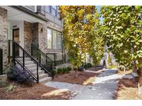 Beautiful brick townhome featuring a well-manicured yard and inviting entrance staircase at 383 Pratt Se Dr # 503, Atlanta, GA 30315