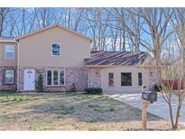 Inviting two-story home with brick and vinyl siding, and a well-maintained front yard at 2593 Fieldstone View Se Ln, Conyers, GA 30013
