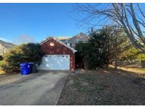 Charming two-story brick home with a well-maintained front yard and attached two-car garage at 304 Klinetop Dr, Mcdonough, GA 30253