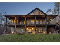 Stunning two-story home with a covered porch, stone accents, and professional landscaping at 101 Bevil Ridge Se Rd, Emerson, GA 30137