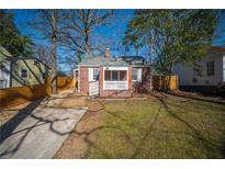 Charming brick home with a well-maintained front yard and a welcoming entrance at 1475 Elizabeth Ln, East Point, GA 30344