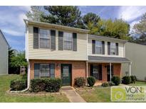Charming two-story home with brick accents, neutral siding, and well-maintained landscaping at 1524 Springleaf Se Cir, Smyrna, GA 30080