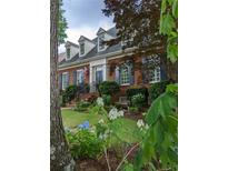 Charming two-story brick home with dormer windows, landscaped yard, and an inviting front entrance at 4610 Wynmeade Ne Park, Marietta, GA 30067