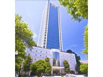 Modern high-rise building with stunning architectural design and lush green landscaping at 2828 Peachtree Nw Rd # 1002, Atlanta, GA 30305