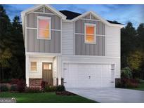 Charming two-story home featuring a two-car garage, modern design, and landscaped front yard at 2034 E Avalon Ridge, Conyers, GA 30013