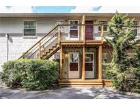 Two story apartment building features brick, stairs, and a small porch at 24 Daniel St # 6, Atlanta, GA 30312