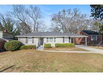 Charming ranch-style home featuring a well-manicured lawn and inviting front entrance at 2716 Wedgewood Ter, Decatur, GA 30032