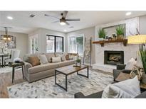 Inviting living room with stylish furniture, stone fireplace, and neutral color palette at 2815 Pine Mountain Nw Cir, Kennesaw, GA 30152