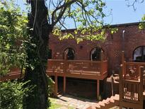 Unique brick exterior with a wooden deck and arched windows at 184 Sw Walker Street # E, Atlanta, GA 30313